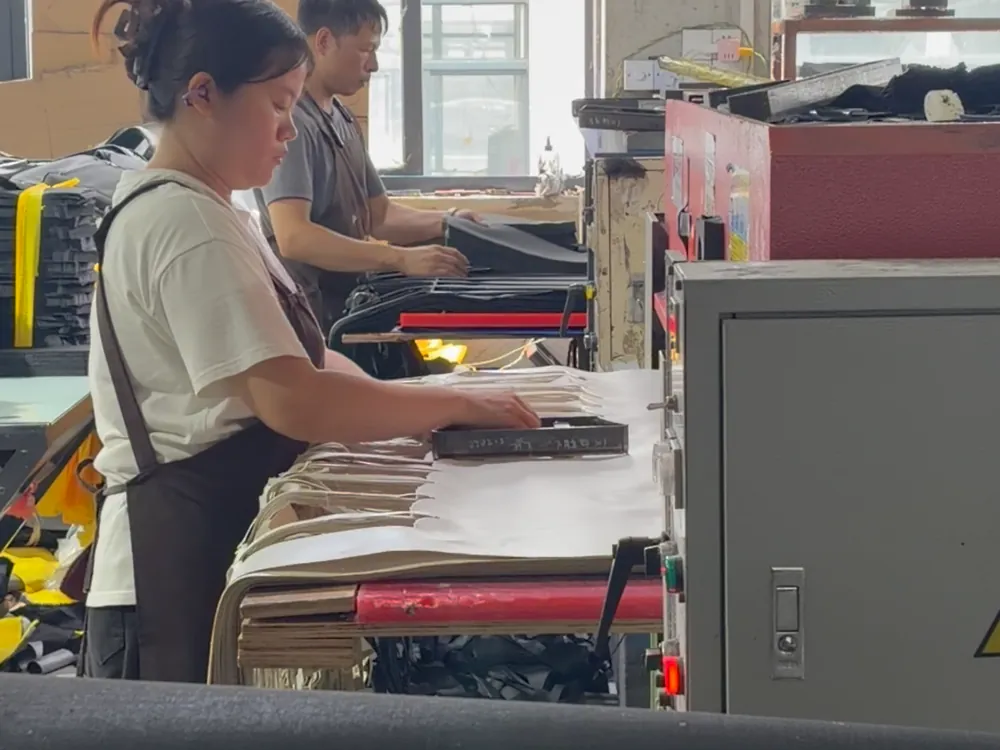 Fabric cutting - layered panels cut to the approved pattern